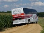 bus stuck on a dirt road